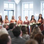 A wedding ceremony in Liberty Hall showing the bridemaids lined up next to the bride.